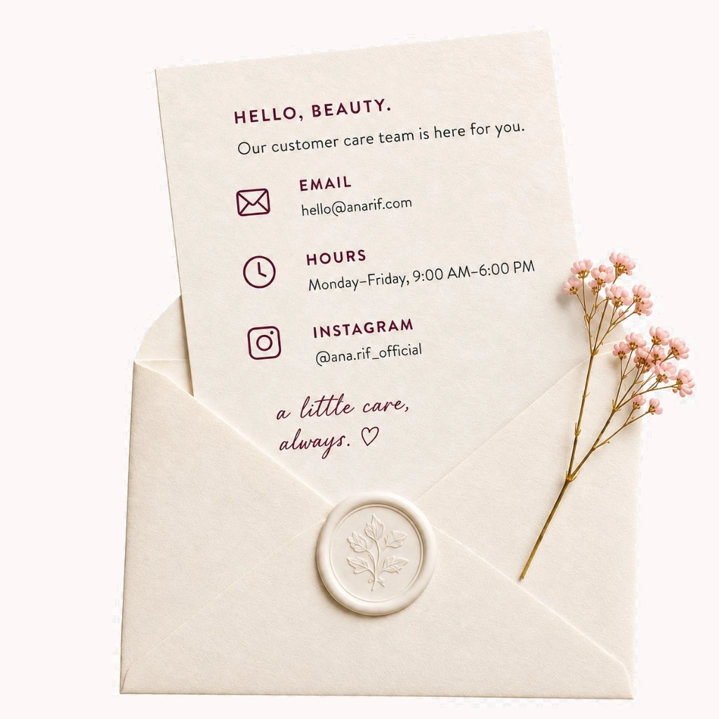 Cream envelope and card with Ana'Rif customer care details, a wax seal and dried flowers