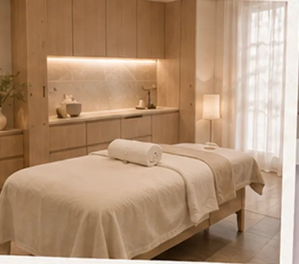 A K-SPA treatment room in warm oak and linen